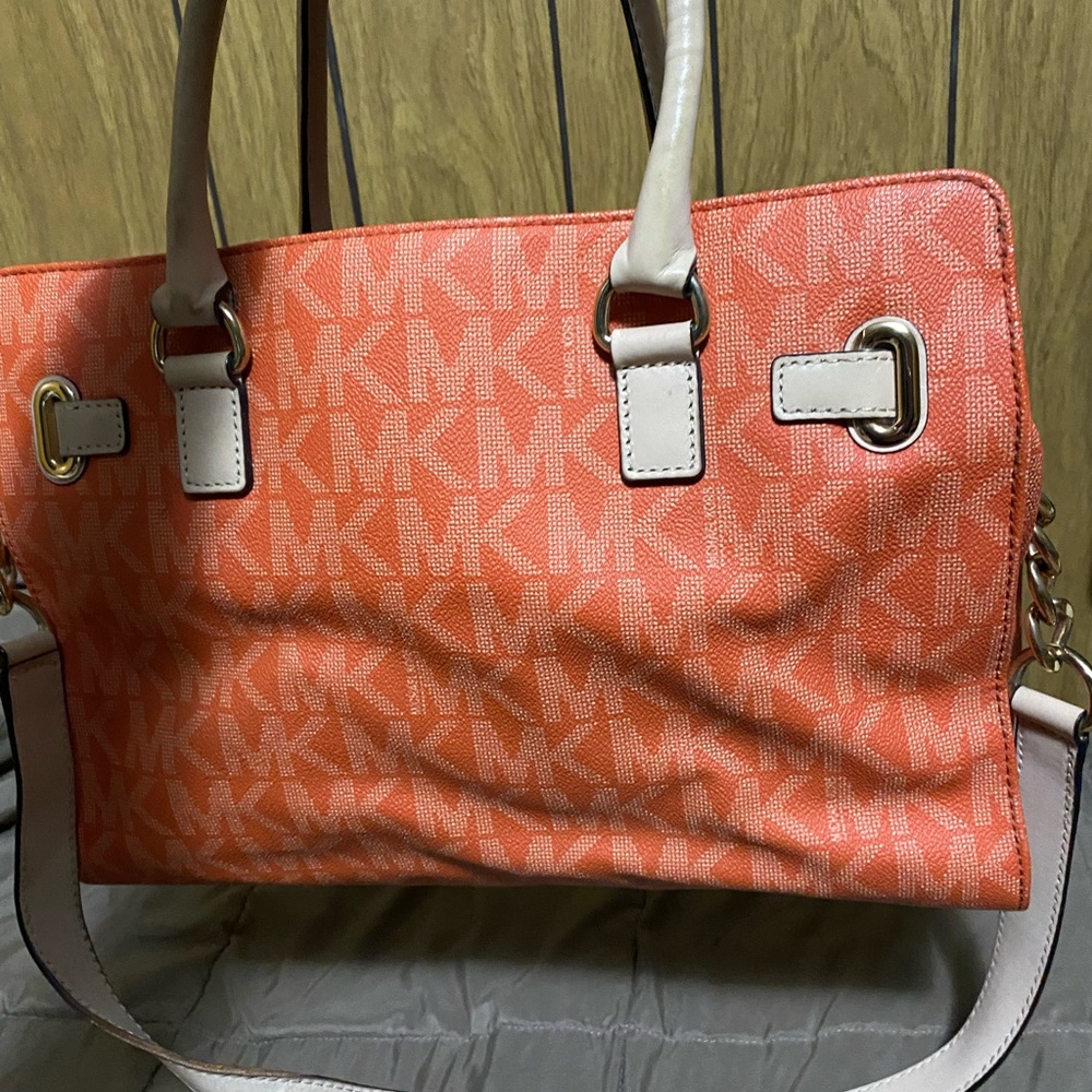 Michael Kors purse. Has some wear on the handles as pictured.